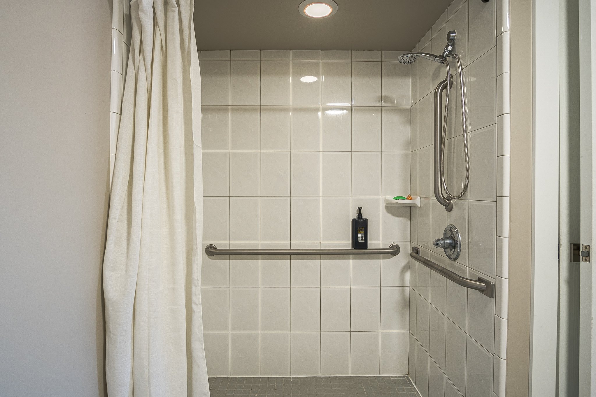 Accessible bathroom shower with grab bars